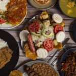 Gastronomía colombiana con platos tradicionales e ingredientes regionales que atraen el interés del turismo.